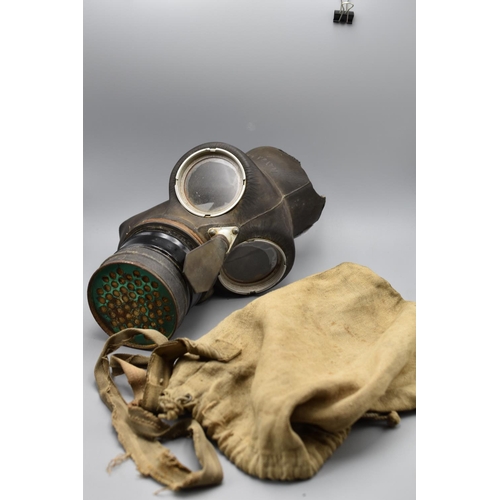 184 - WW2 British civilian duty gas mask with a linen shoulder bag