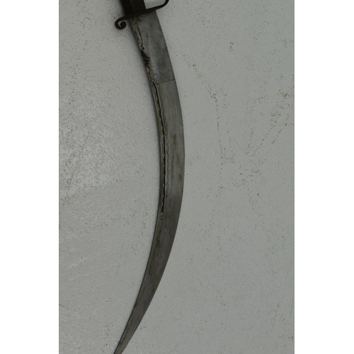 78 - North African Nimcha sword with a metal inlaid wooden hilt and scabbard. 59cm long