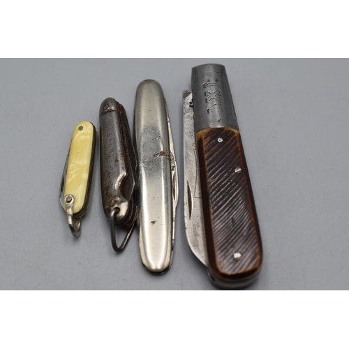 105 - Four Vintage pocket clasp knives. Largest made by IXL George Wolstenholme, Sheffield England