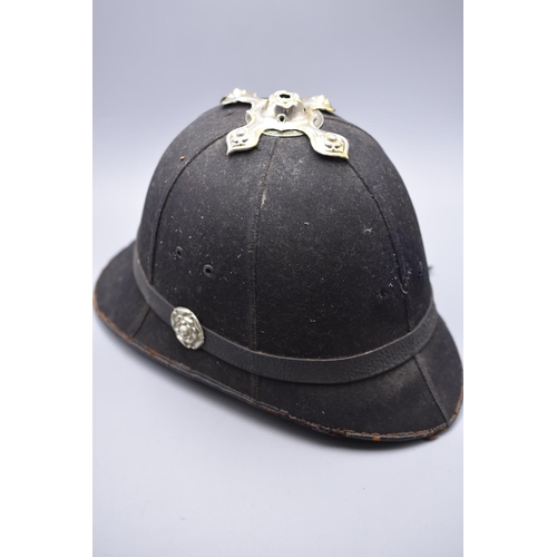 129 - Vintage cork bodied helmet with six blue cloth panels. Complete with some metal fittings