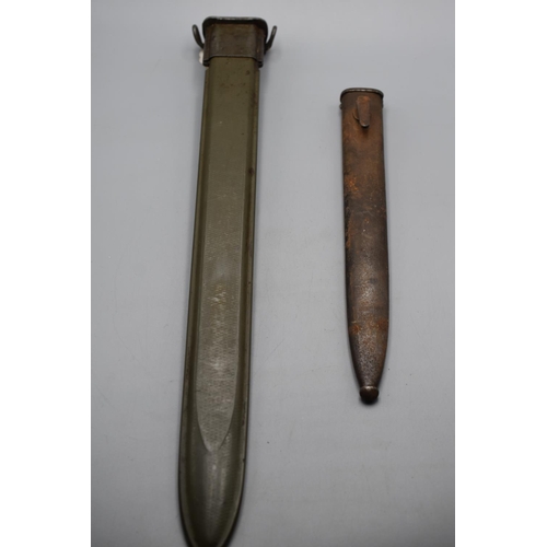 149 - WW2 US bayonet scabbard plus a smaller steel bayonet scabbard