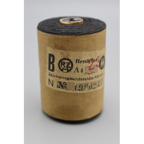 101 - WWII German SS Black cotton reel with two labels attached