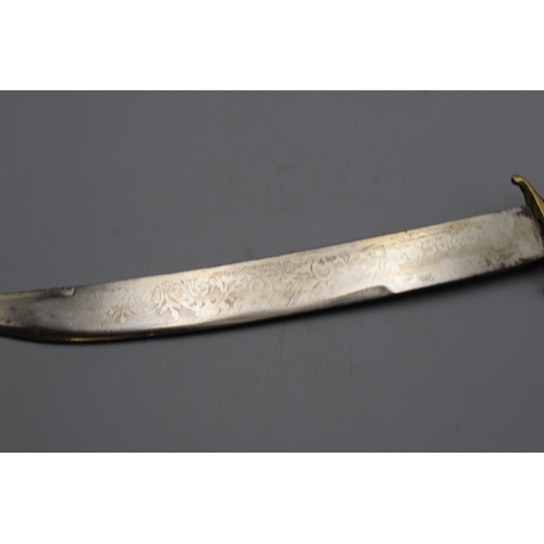 89 - Curved ethnic dagger with etched decoration