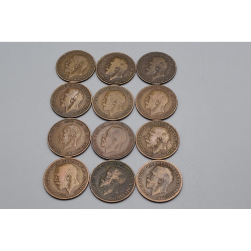 22 - Twelve George V Pennies