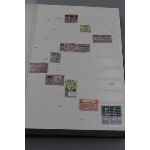 39 - Album Containing a Large Selection of US Postal Service Stamps dating From 1898