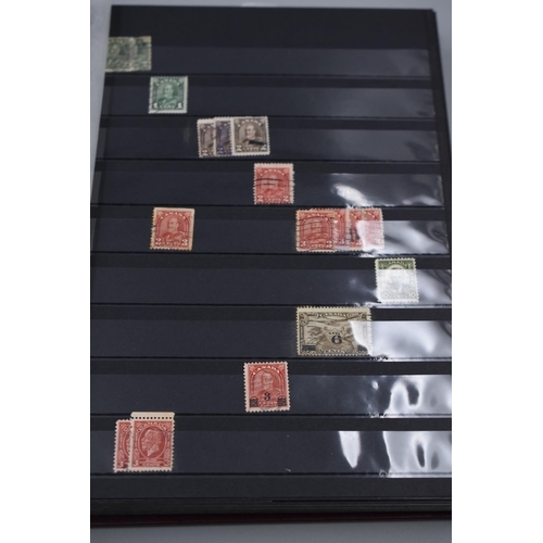 61 - Album Containing a Selection of Canadian Post Marked Stamps Ranging From Queen Victoria to Elizabeth... 