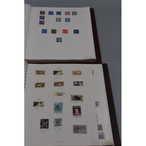 81 - Two Stanley Gibbons Albums Containing Stamps From Scotland, Northern Ireland, Wales, and Australia.