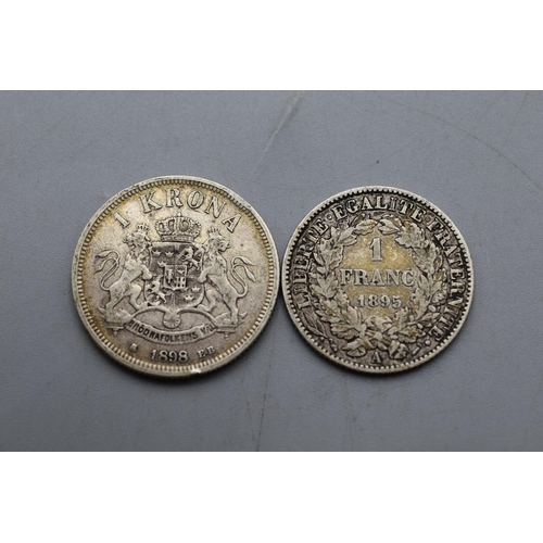 26 - Two Foreign Silver Coins