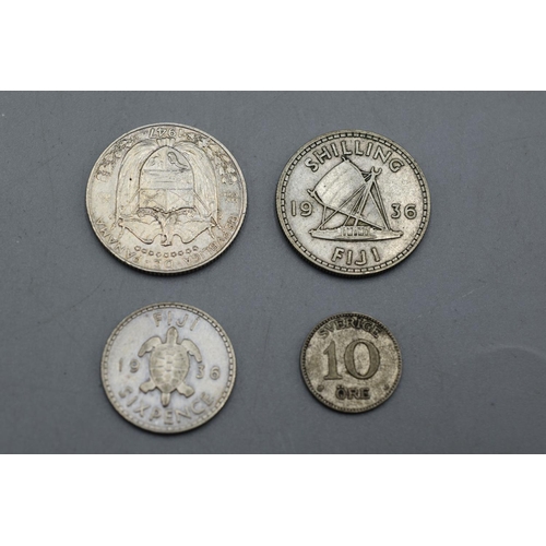 20 - Four Worldwide Silver Coins. Includes Fiji Sixpence and Shilling, 10 Ore Coin and Panama 1/4 Balboa ... 