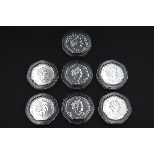 15 - Selection of Seven Silver & Gold Plated Platinum Jubilee Fifty Pence Coins. Includes Caritas in all ... 