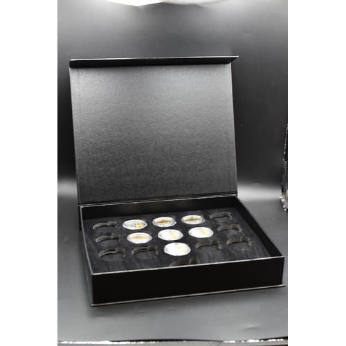 15 - Selection of Seven Silver & Gold Plated Platinum Jubilee Fifty Pence Coins. Includes Caritas in all ... 