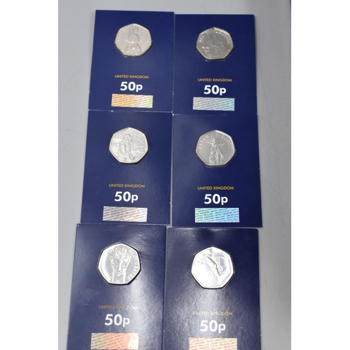 29 - Selection of 52 Mounted Change Checker 50p Coins including Jemma Puddle duck, Team GB, Paddington, P... 