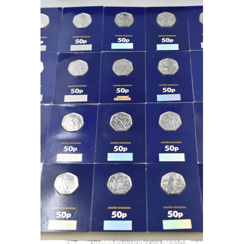 29 - Selection of 52 Mounted Change Checker 50p Coins including Jemma Puddle duck, Team GB, Paddington, P... 