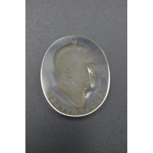 151 - WWII Nazi German Adolf Hitler Portrait Glass Pendant. 3.5cm Long and 3cm Wide. Portrait cut out of b... 