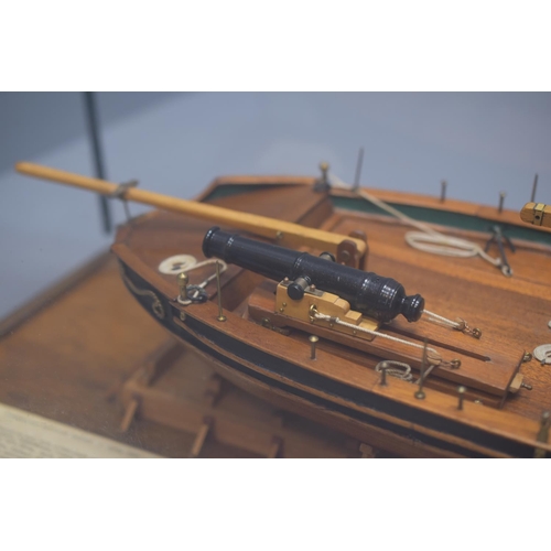 152 - Large Cased Scale Model of Commissioner Harrison's Gunboat of 1808 in a Glass Case. 89cm Long, 31cm ... 