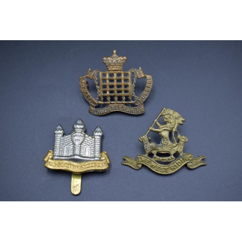 159 - Selection of three Military Badges including The West Riding, Royal Gloucestershire Hussars, and The... 