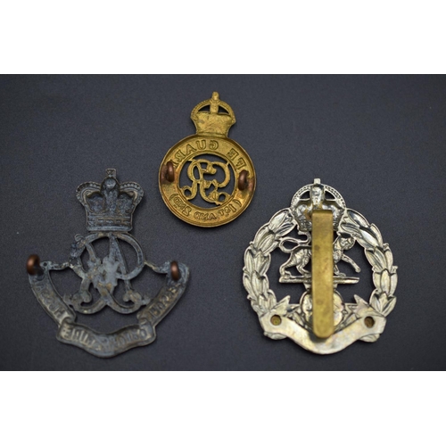 160 - Three Military Badges including The Queens Oxfordshire Hussars, Royal Hampshire and The Life Guards