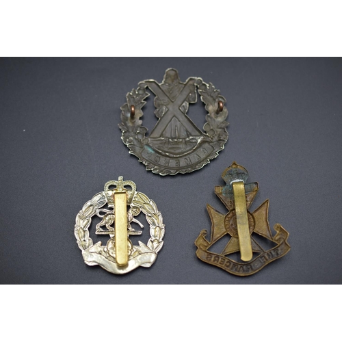 161 - Three Military Badges Including The Royal Hampshire, The Rangers and The Queens Own Cameron Highland... 