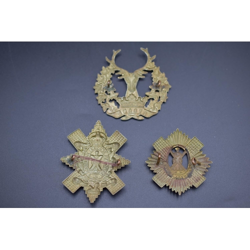 175 - Three Scottish Cap Badges includes, The Royal Scots, Gordon Highlanders and Blackwatch