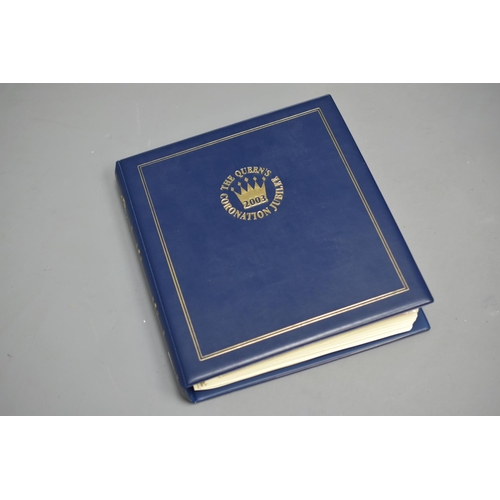 86 - Album Containing a Set of First Day Covers and Commemorative Coins for Queen Elizabeth II Coronation... 