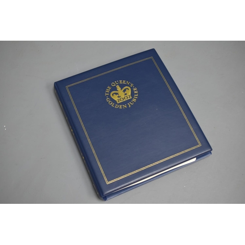 101 - Album Containing a Selection of Coins and First Day Covers for Queen Elizabeth II Golden Jubilee. In... 