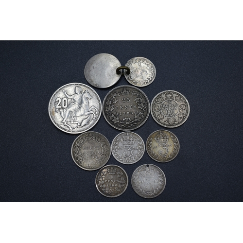 7 - Selection of 9 Silver Foreign Coins