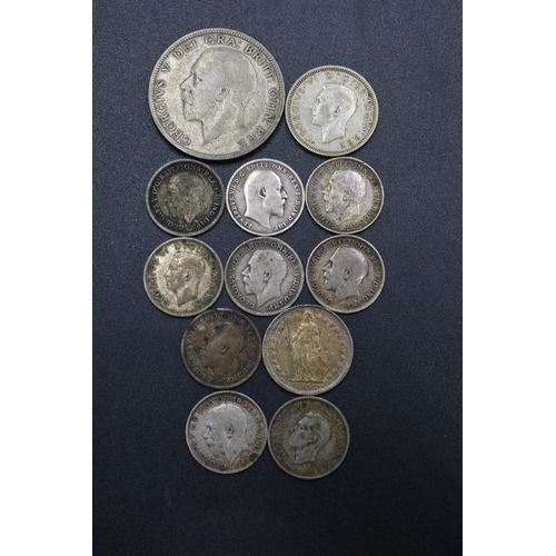 54 - A Selection of Twelve Silver Coins To Include Nine Threepences (1909-1938), 1943 Sixpence, Swiss 1/2... 