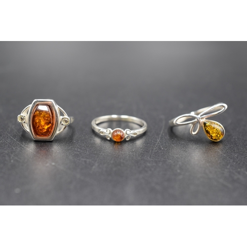 42 - Three Silver 925 Amber Stoned Rings