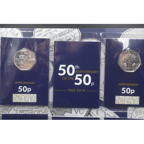 1 - Five Change Checker Mounted 50p Coins including D Day, Victoria Cross, Victoria Cross Soldier, Battl... 