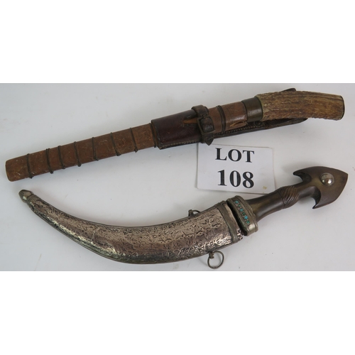 108 - An antique Eastern curved dagger with white metal scabbard and turquoise inlaid horn handle plus an ... 