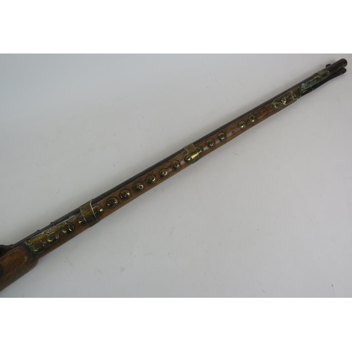 109 - A mid 19th British army Tower armoury percussion rifle, later modified in Arabia with pinwork and br... 