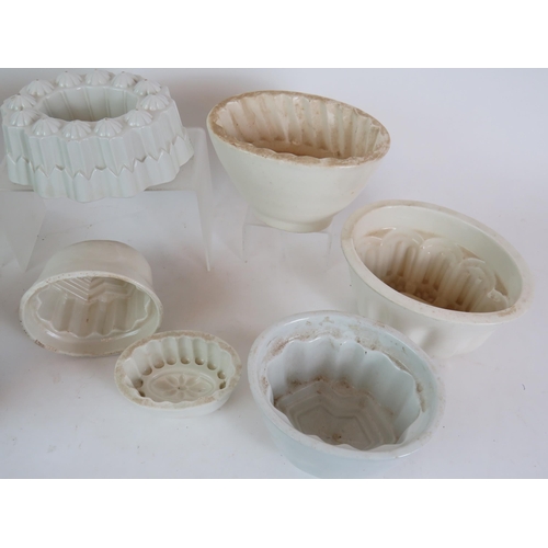 118 - A collection of nine antique white porcelain jelly moulds including Copeland, Shelley & Wedgwood. La... 