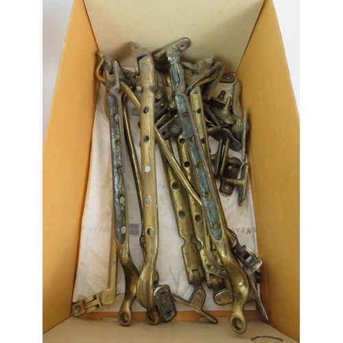 123 - Two boxes of salvaged brass door and window fittings including knob sets, escutcheons, sash locks et... 