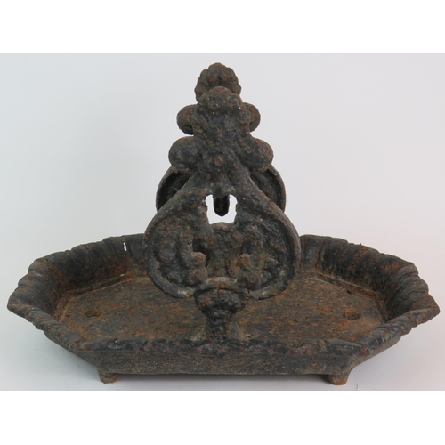 124 - A Victorian cast iron boot scraper in well weathered condition 36cm x 25cm x 24cm. Condition report:... 