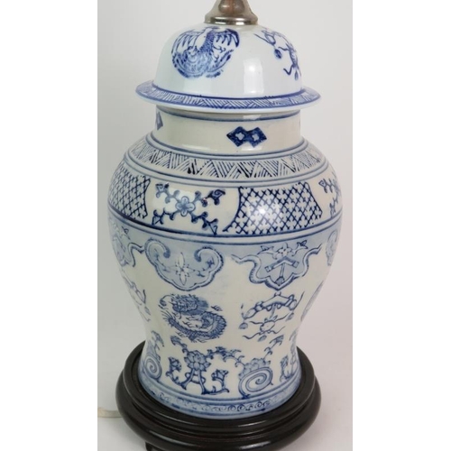 126 - A blue and white Chinese porcelain covered jar table lamp on turned wooden base, height 38cm. Condit... 