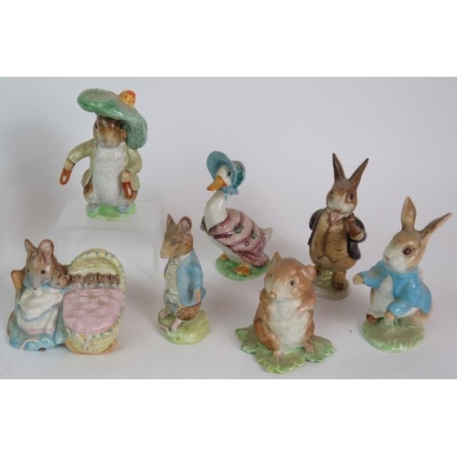 130 - A collection of thirteen Beswick Beatrix Potter figures with gold oval back stamps C1950s. (13). Con... 