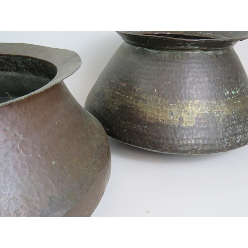 147 - Three decorative Eastern beaten copper pots of graduated size, ideal for logs! Largest 42cm diameter... 