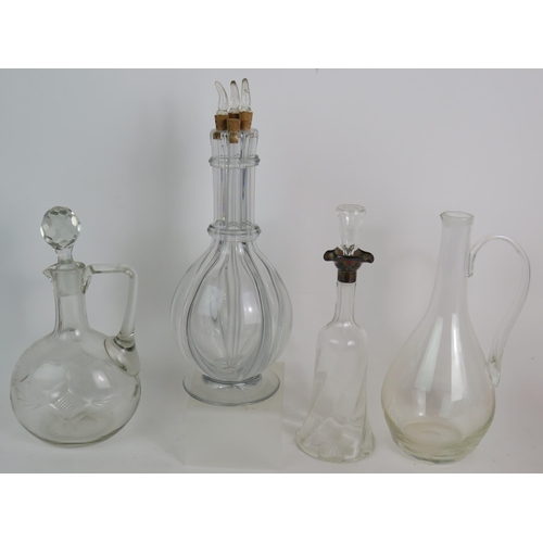 148 - Seven mixed 19th/20th Century decanters and claret jugs including a French four section liqueur deca... 