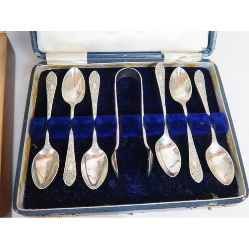 149 - A wooden canteen of Edwardian silver plated fish cutlery, a cased set of tea spoons, a cased set of ... 