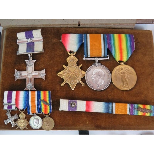 15 - A WWI military cross medal group and associated militaria medals awarded to Lt Col L. D. Scott, East... 