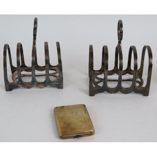 150 - A pair of silver plated toast racks circa 1920's, a silver plated cream jug, an Asian bone and brass... 