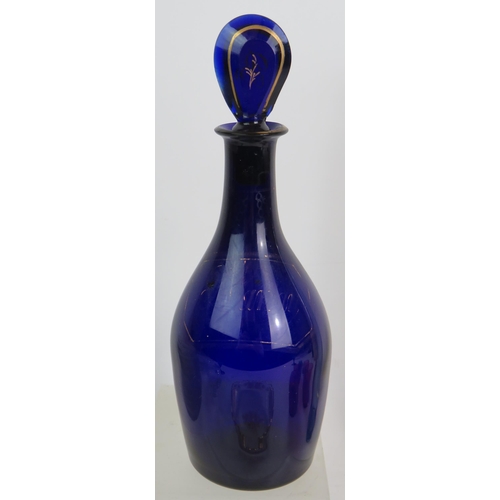 152 - An early 19th Century Bristol blue glass brandy decanter with gilt decoration and lozenge stopper pl... 