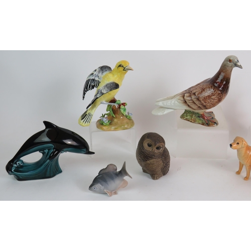 153 - Two Beswick pottery Labradors, a Beswick pigeon, 2 Crown Staffordshire birds, two Poole pottery figu... 