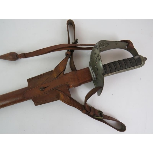 15A - A WWI officer's dress sword with leather scabbard and frog, property of Lt Col L. D. Scott M. C. Ove... 