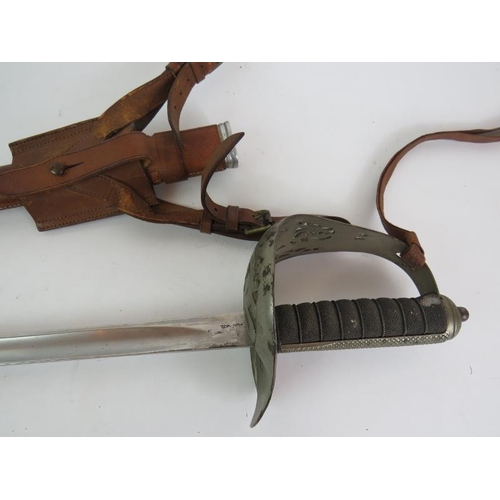 15A - A WWI officer's dress sword with leather scabbard and frog, property of Lt Col L. D. Scott M. C. Ove... 