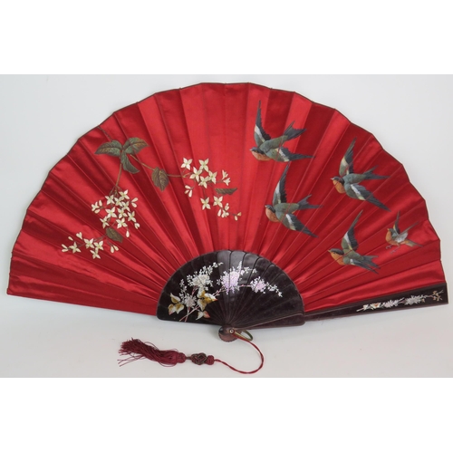 160 - Two hand painted Chinese fans, largest 72cm, and two hand stitched Chinese silk panels in frames, la... 