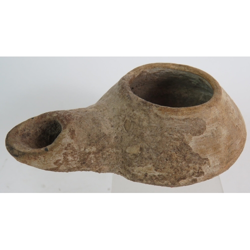 172 - An ancient pottery oil lamp possibly Roman plus a collection of archaeological finds, mainly shards ... 