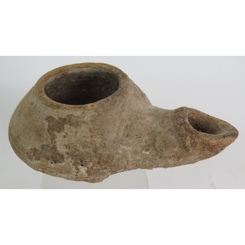 172 - An ancient pottery oil lamp possibly Roman plus a collection of archaeological finds, mainly shards ... 