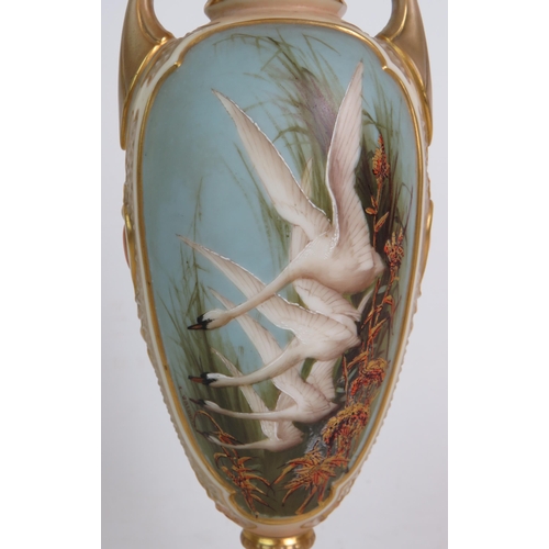 18 - A fine Royal Worcester porcelain vase of classical style with swan decoration to the front cartouche... 