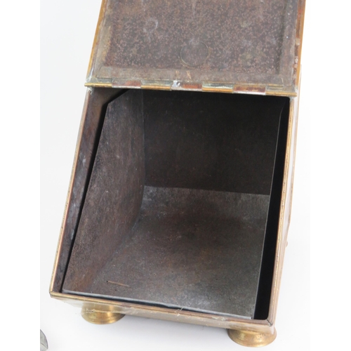 181 - A brass Edwardian coal scuttle and shovel with embossed lid and turned wood handles. Zinc liner incl... 